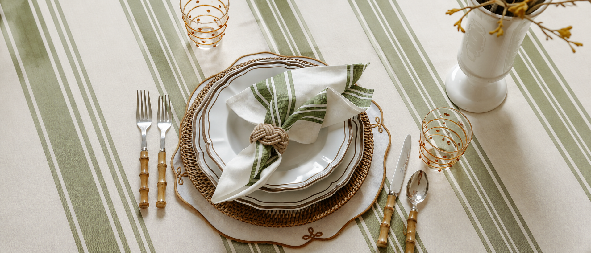Elegant dinnerware arranged on a naturally styled dining table